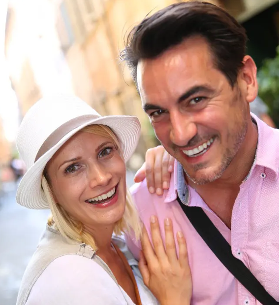man and woman smiling