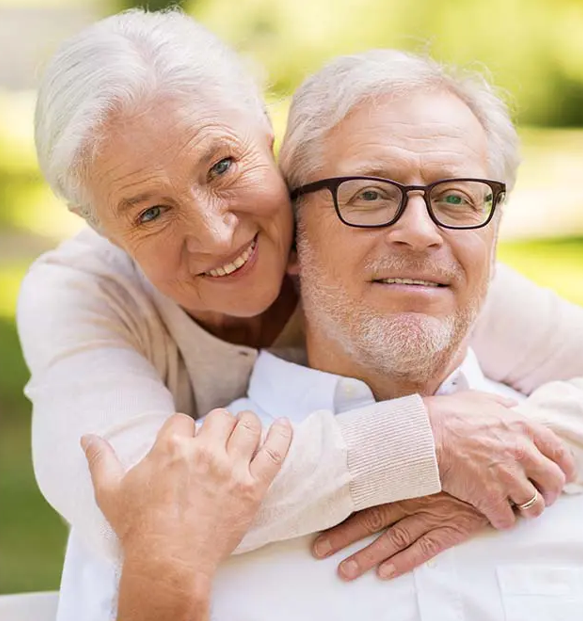 woman hugging her husband's shoulders