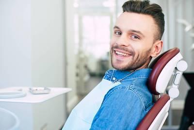 Belmont man smiling in dental chair