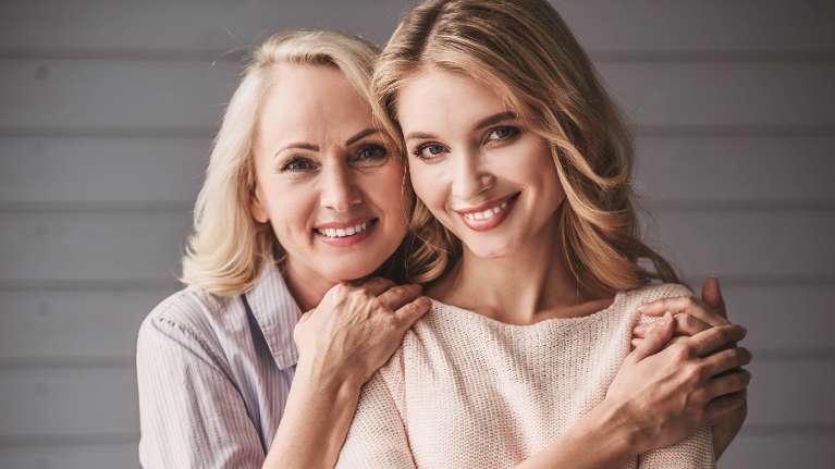 mother and daughter smiling