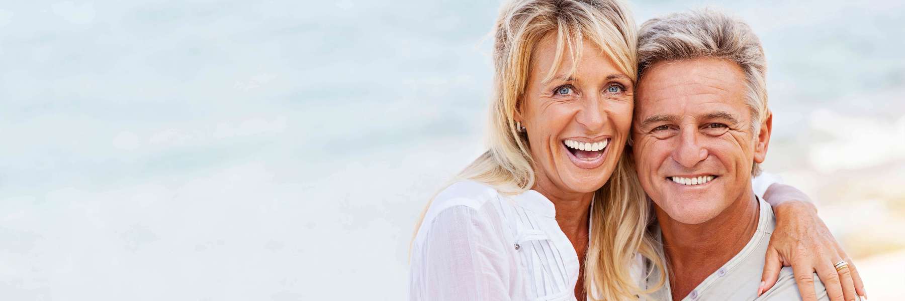 man and woman smiling