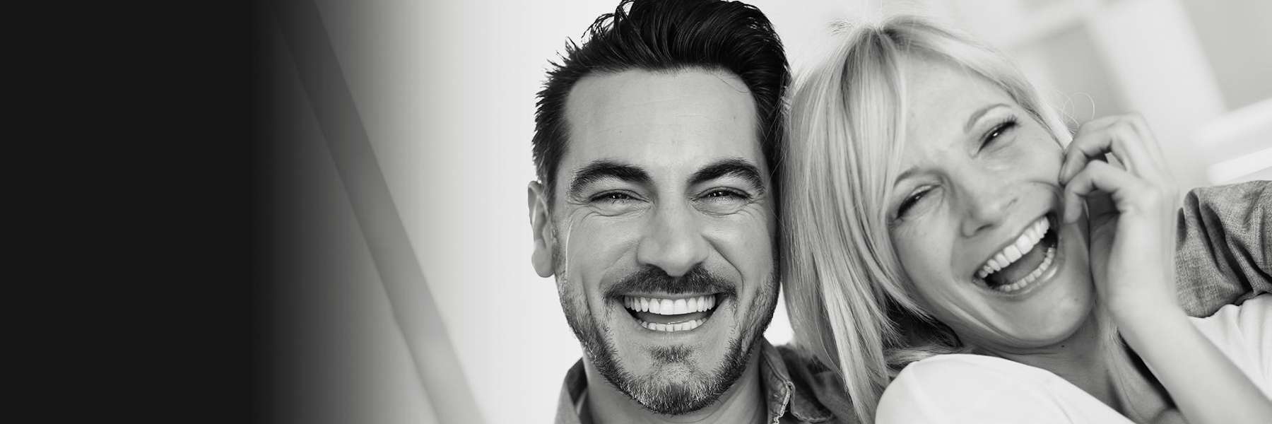 man and woman smiling