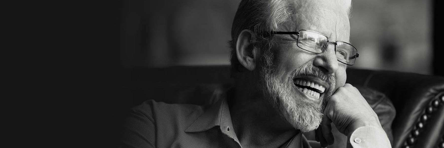 belmont man smiling after getting dentures