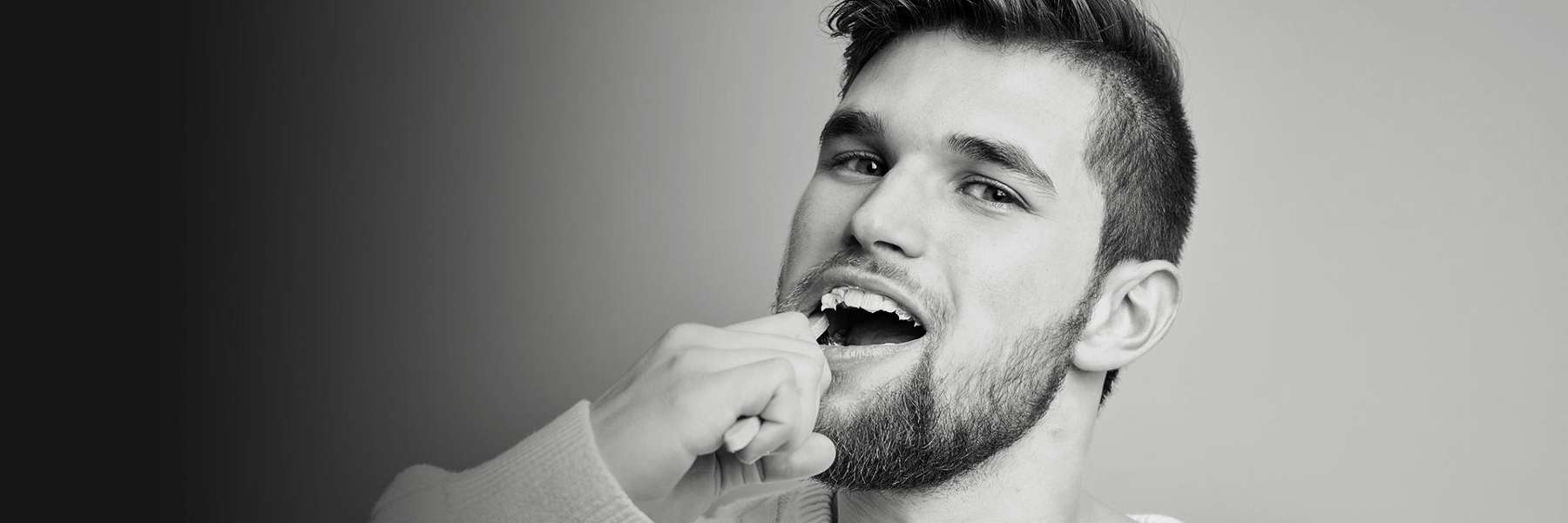 man brushing teeth in belmont